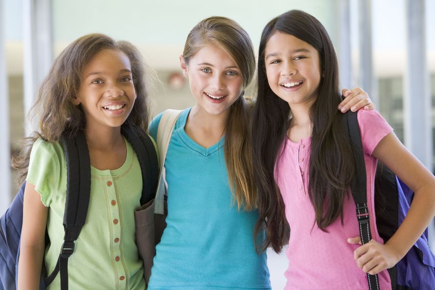 three preteen girls