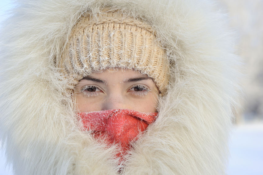 51908689 - girl with frost on the eyes. the white fur coat and hood. very cold, frost. his face is closed, you can see only the eyes