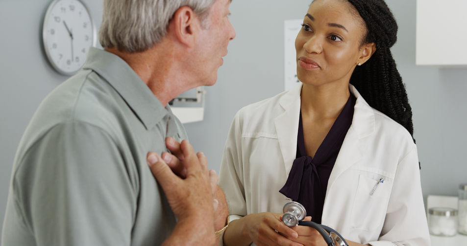 50870404 - black woman doctor listening to elderly patient breathing