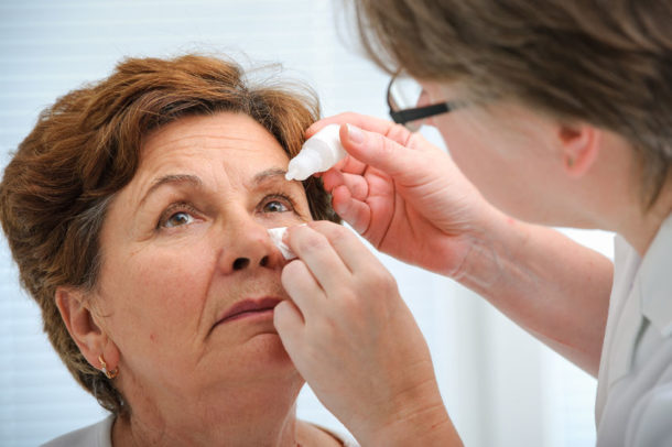 30402691 Doctor Helps The Patient And Gives The Eye Drops Horizon 30402691 doctor helps the patient and gives the eye drops horizon