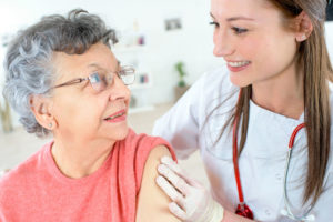 Senior woman getting flu shot