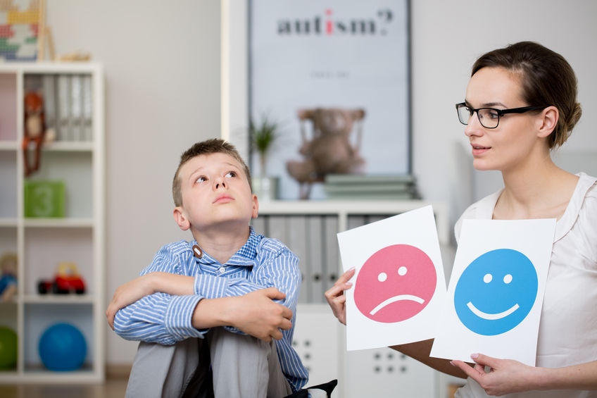 autistic boy and his psychologist during a meeting