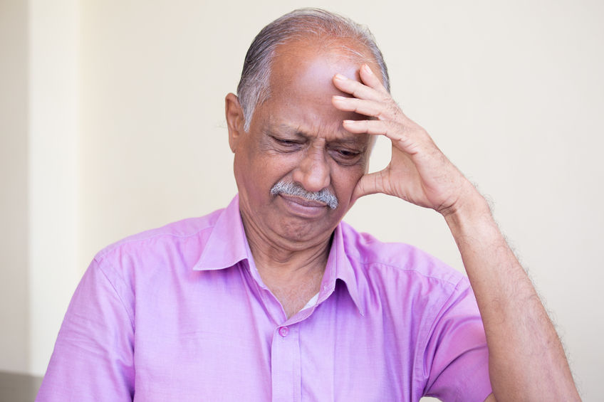 Closeup portrait, morose elderly pensioner, downcast gloomy, resting hand on head, isolated indoors home background. Negative emotion facial expressions