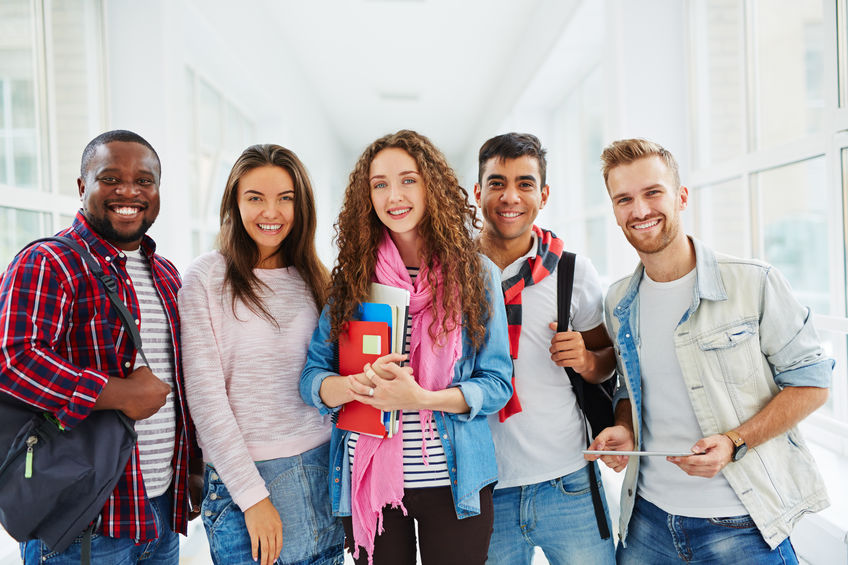 Happy college students looking at camera with smiles