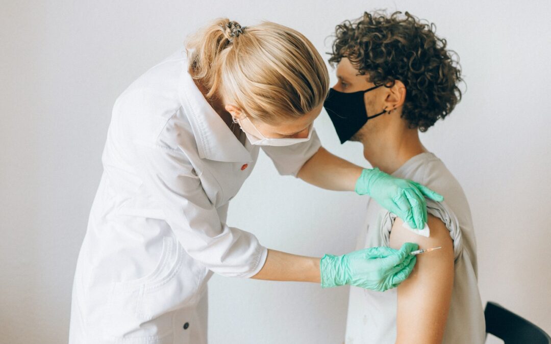 man getting a seasonal flu vaccine