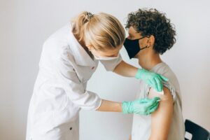 man getting a seasonal flu vaccine