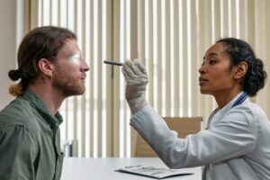 doctor performing an eye exam