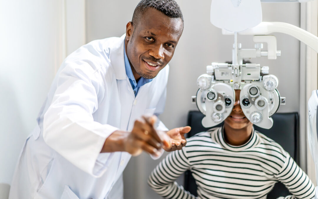 Optician doing optometry eye exam for teenager.