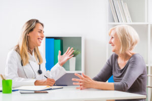 senior woman talking with her doctor about mental health.