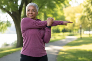 Older woman stretching before exercising